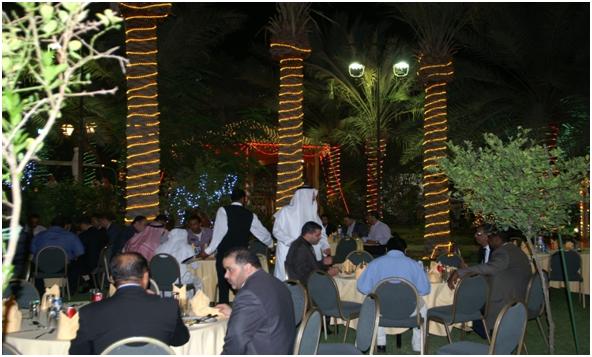 Shown here are some  employees  chatting with  each other while  enjoying the warmth and cozy atmosphere  on  the beautiful garden  located just at the back of Sheikh Ali?s grandiose palace.